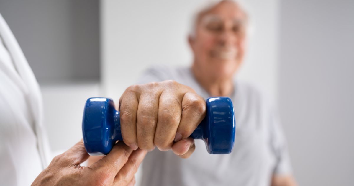 Man using weight for physical therapy